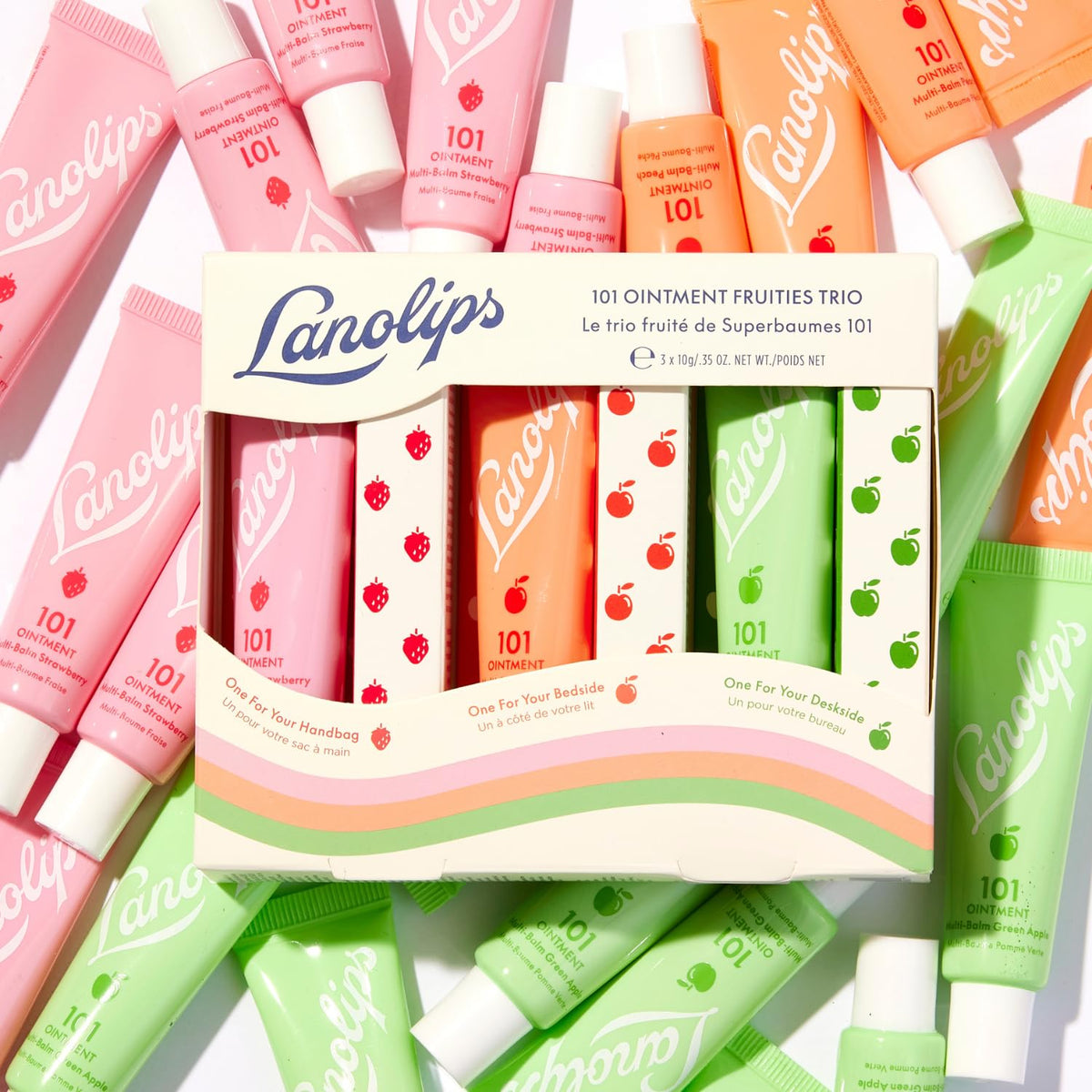 Lanolips three tins in hand showing compact travel size and portability