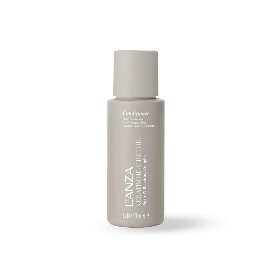 L’ANZA Keratin Healing Oil Conditioner bottle demonstrates deep moisture for soft hair.