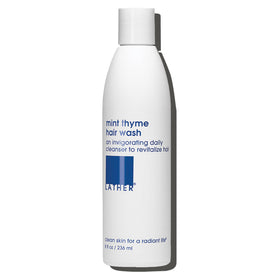LATHER Mint Thyme Hair Wash bottle pour delivers a refreshing cleanse.
