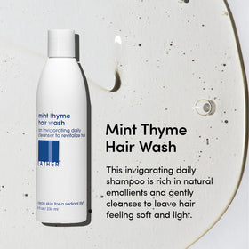 LATHER Mint Thyme Hair Wash close-up of ingredients highlights chamomile, cucumber for soothing scalp.
