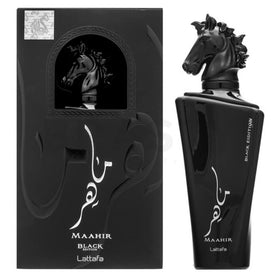 Lattafa Maahir Black Edition bottle pour, hinting at an amber-spice evening scent.