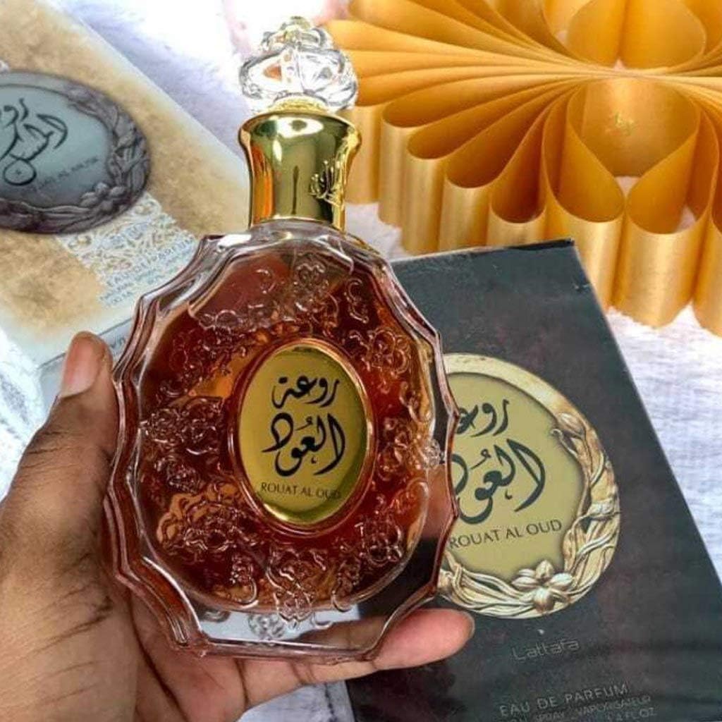 Lattafa Rouat Al Oud note graphic emphasizes citrus, spice, and woody base.