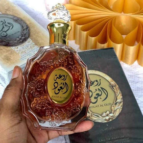 Lattafa Rouat Al Oud note graphic emphasizes citrus, spice, and woody base.