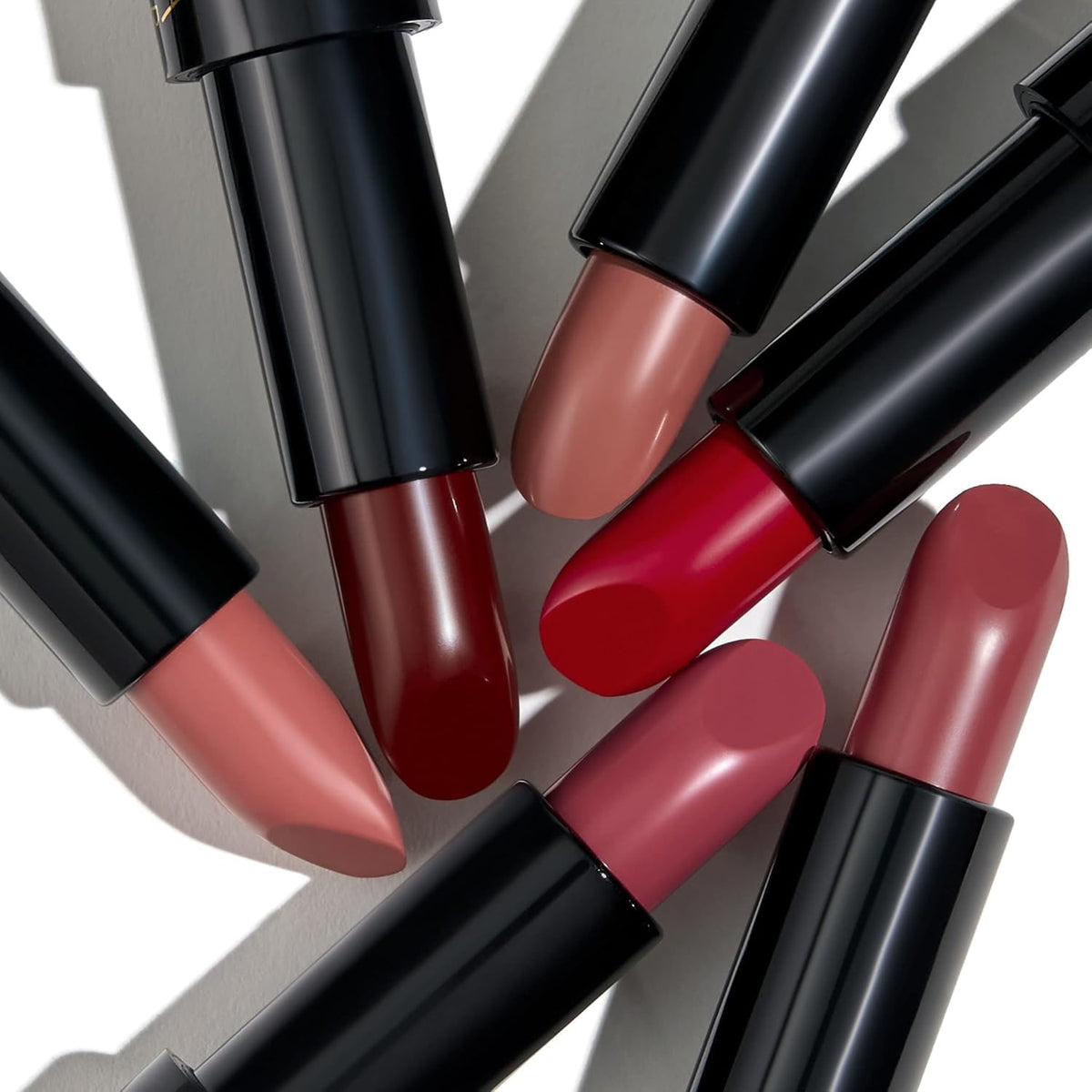 Laura Geller Modern Classic Lipstick Berry Bliss on lips showing creamy finish.
