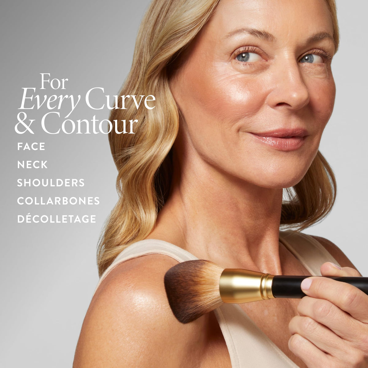Laura Geller New York Classic Bronzer Brush blending motion creates seamless sun-kissed finish.