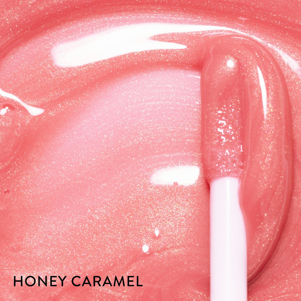 LAURA GELLER NEW YORK Color Luster Lip Gloss Honey Caramel packaging showcases the elegant tube.