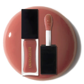 Laura Geller New York Fine Shine Lip Oil bottle delivers hydrating shine.