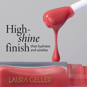 LAURA GELLER NEW YORK lip oil swatch on lip highlights soft coral glow