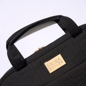 Laura Geller New York full-size makeup storage holds multiple items for extended trips.