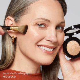  Laura Geller New York highlighter cream texture blends smoothly for weightless glow.