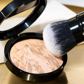 LAURA GELLER NEW YORK Hydrate 2-in-1 Moisturizer and Primer bottle nourishes and primes.