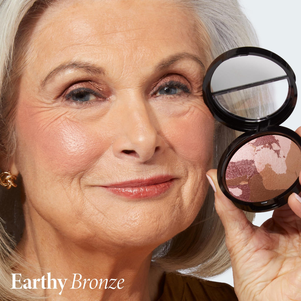 LAURA GELLER NEW YORK marbleized powder swirl closeup showing rosy-bronze hues for balanced glow.