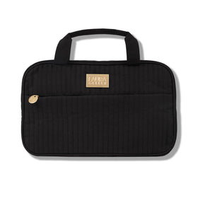 Laura Geller New York quilted folding travel makeup bag in black for easy, organized cosmetics on the go.