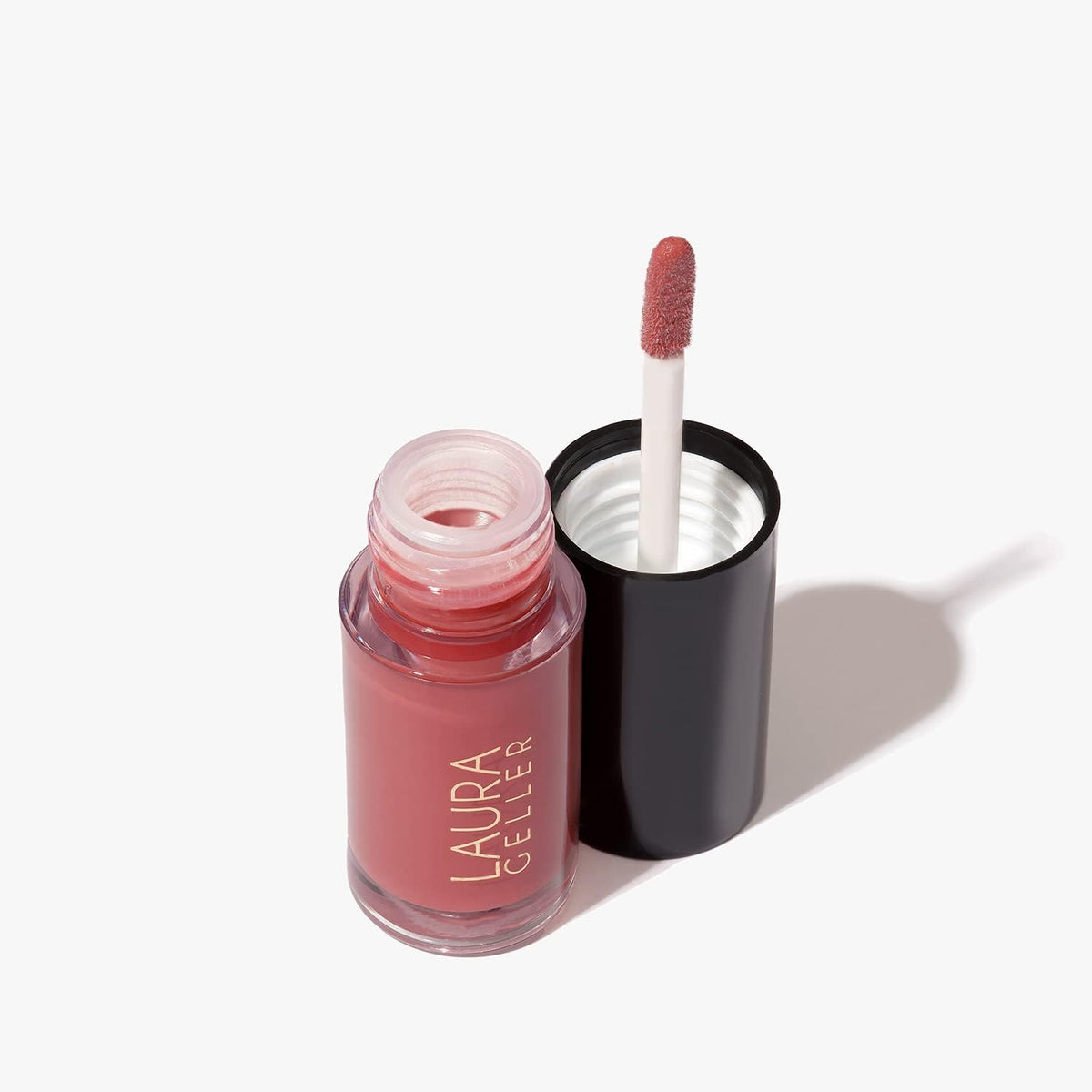 LAURA GELLER NEW YORK Treat-n-Go lip oil overnight hydration use by bedside.