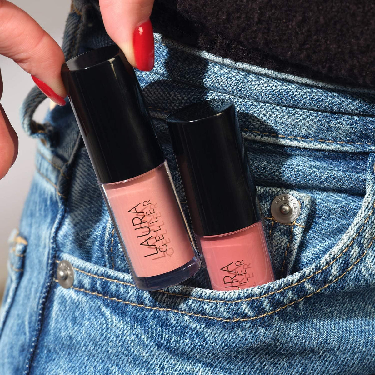 LAURA GELLER NEW YORK Treat-n-Go lip oil packaging with bag suggests on-the-go hydration.