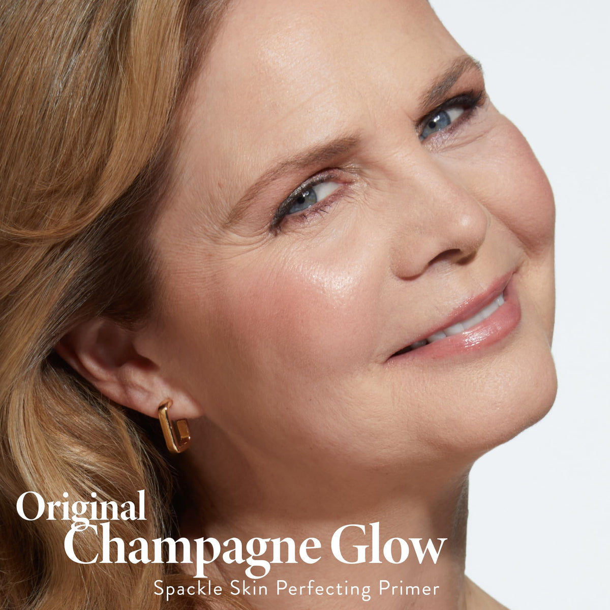 Laura Geller Spackle Duo champagne glow swirl highlights luminous skin.