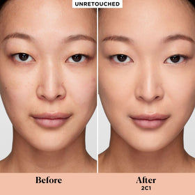 Laura Mercier Real Flawless Serum Concealer applicator in use for precise under-eye coverage.