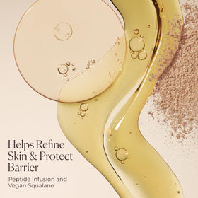 Close-up of pump dispensing Laura Mercier Tinted Blur Balm.