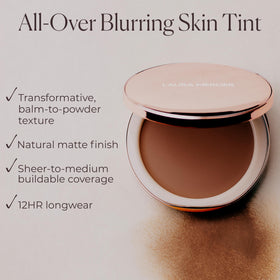 Swatch of Laura Mercier Tinted Blur Balm on skin showing natural finish.