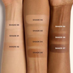 Close-up swirl texture of balm-to-powder transition on skin.