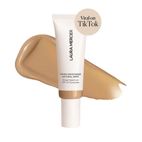 Laura Mercier Tinted Moisturizer swatches show sheer-to-light coverage for natural tone.