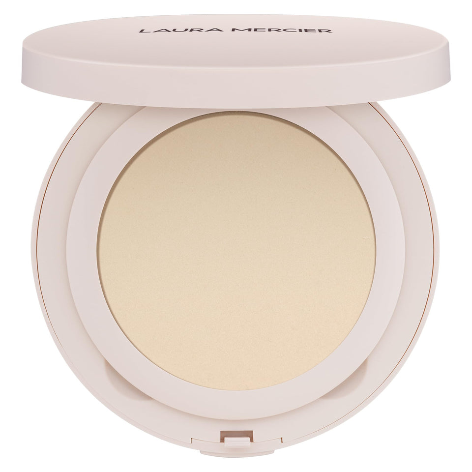 Laura Mercier Ultra-Blur translucent powder with puff for on-the-go setting.