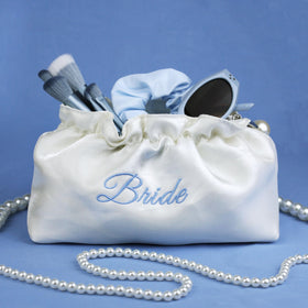 Lauusiusi wedding day essential pouch—timeless satin sheen that complements gowns.