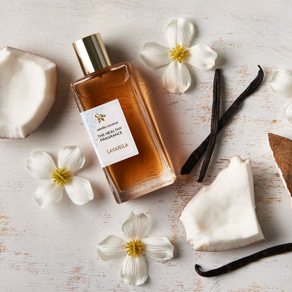 Cap and bottle detail of Lavanila Vanilla Coconut Perfume