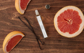 LAVANILA roller on wrist illustrates portable fragrance for instant mood lift.