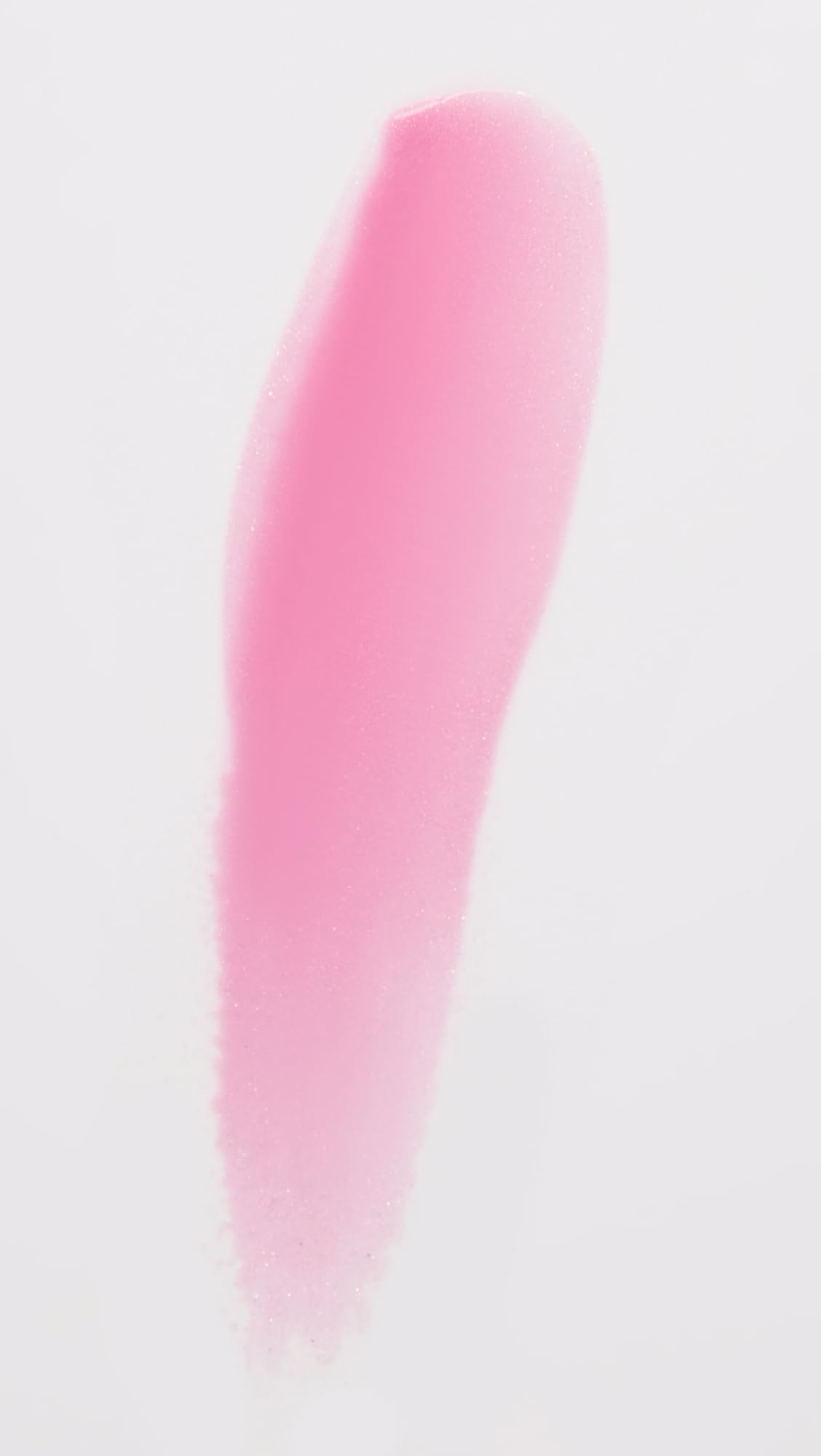 Daisy Pink swatch on lips shows a glossy finish with soft glow.