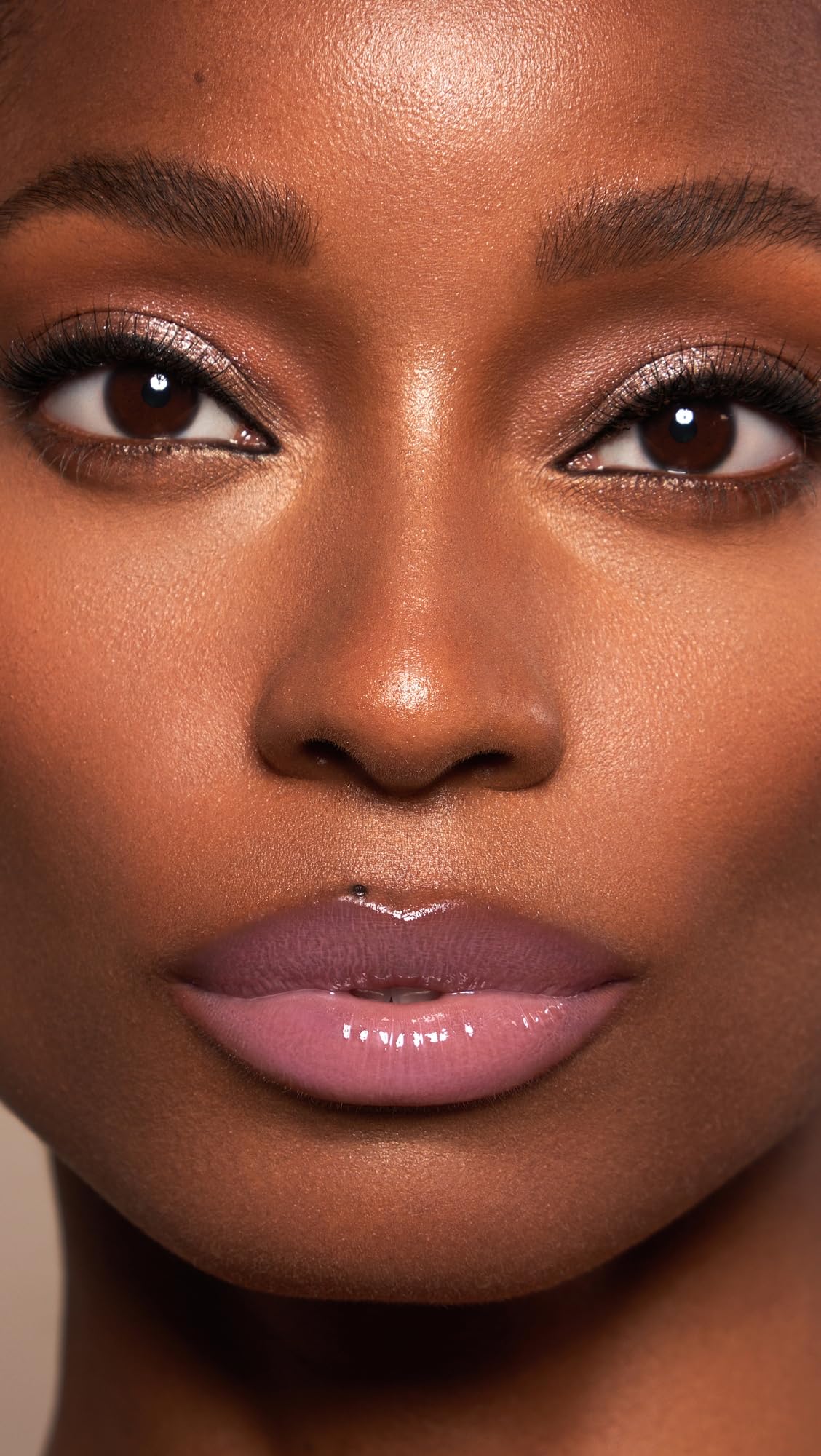 Creamy Daisy Pink gloss spreads smoothly for even application.