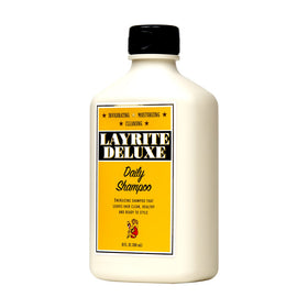 Close-up of Layrite Daily Shampoo foamy lather for removing buildup and prepping hair.