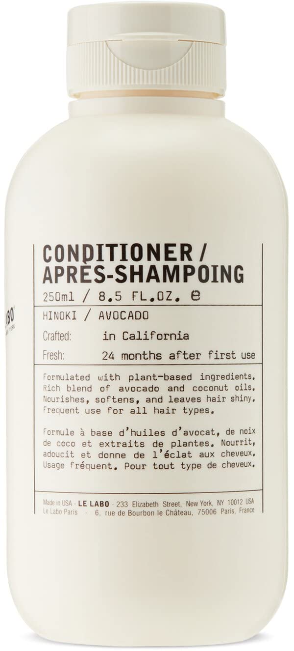 Le Labo Hinoki conditioner bottle for daily nourishing hair care with a refined scent.