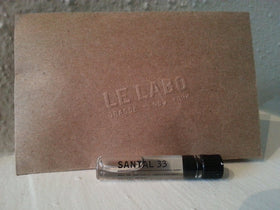 Le Labo Santal 33 sample bottle for on-the-go testing of the iconic woody fragrance.