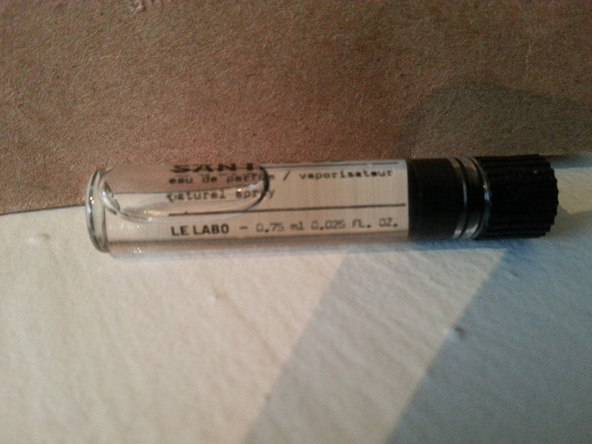 Le Labo Santal 33 sample vial highlighting its potent aroma in a compact format.
