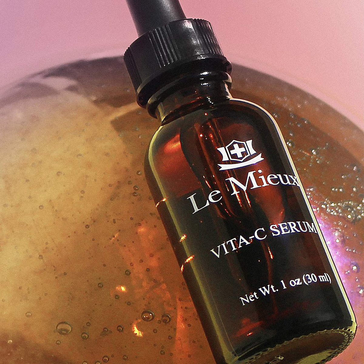 Le Mieux Vita-C Serum serum drop on hand ready for daily use.
