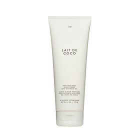 Le Monde Gourmand Lait de Coco icing bottle closeup, creamy coconut richness for hydrated skin.