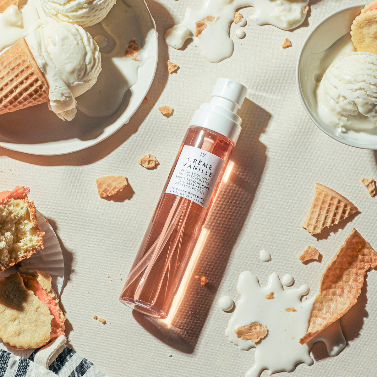 Le Monde Gourmand Crème Vanille Fresh Mist spray close-up with a delicate floral-vanilla scent.