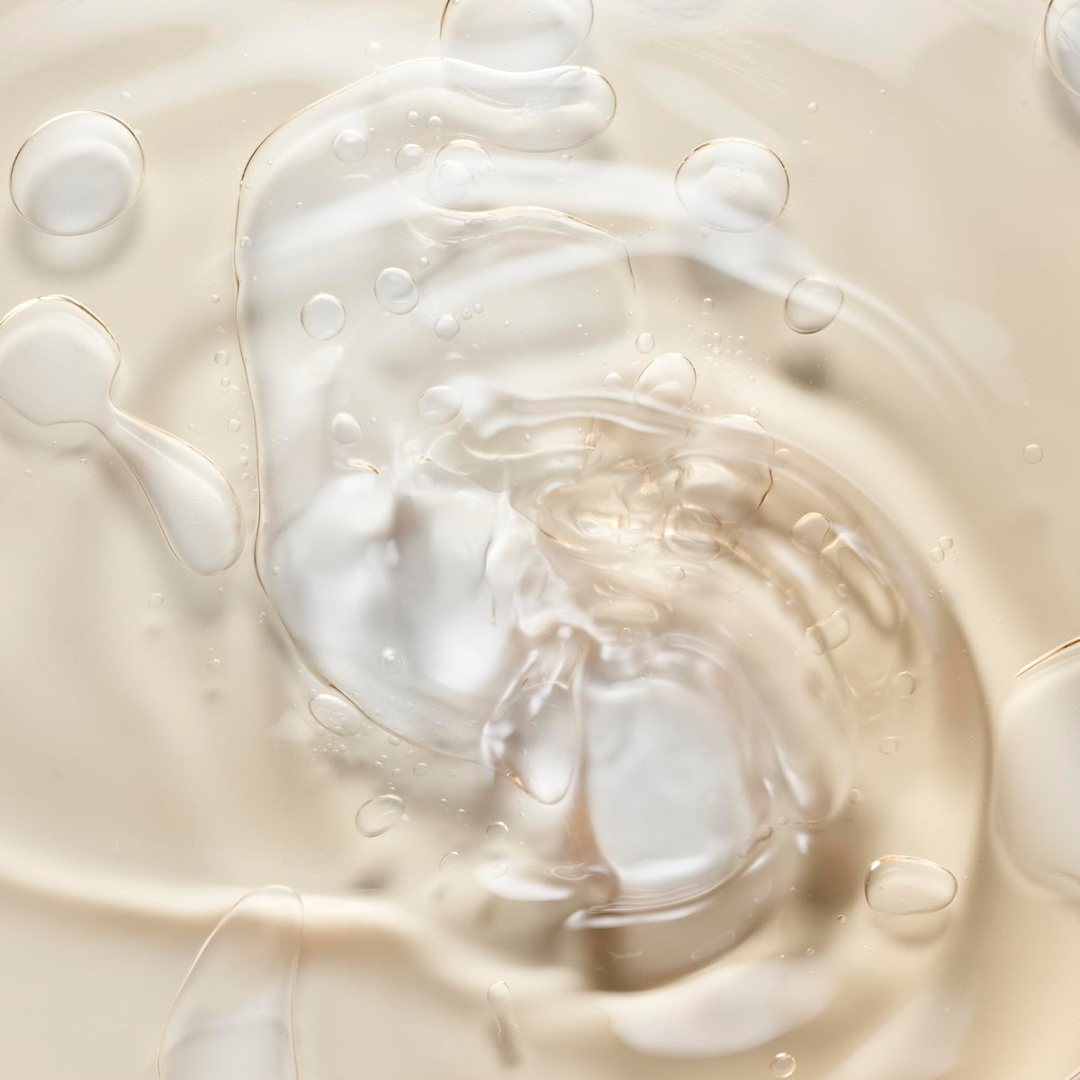 Le Monde Gourmand body oil applied to skin for a light, non-greasy glow.