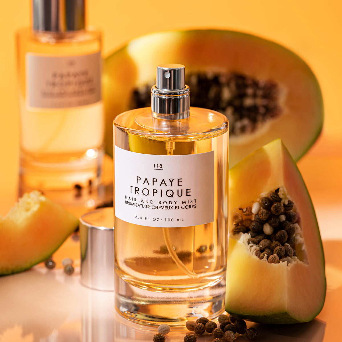 Body mist on skin from Le Monde Gourmand Papaya Tropique for a light, airy feel.