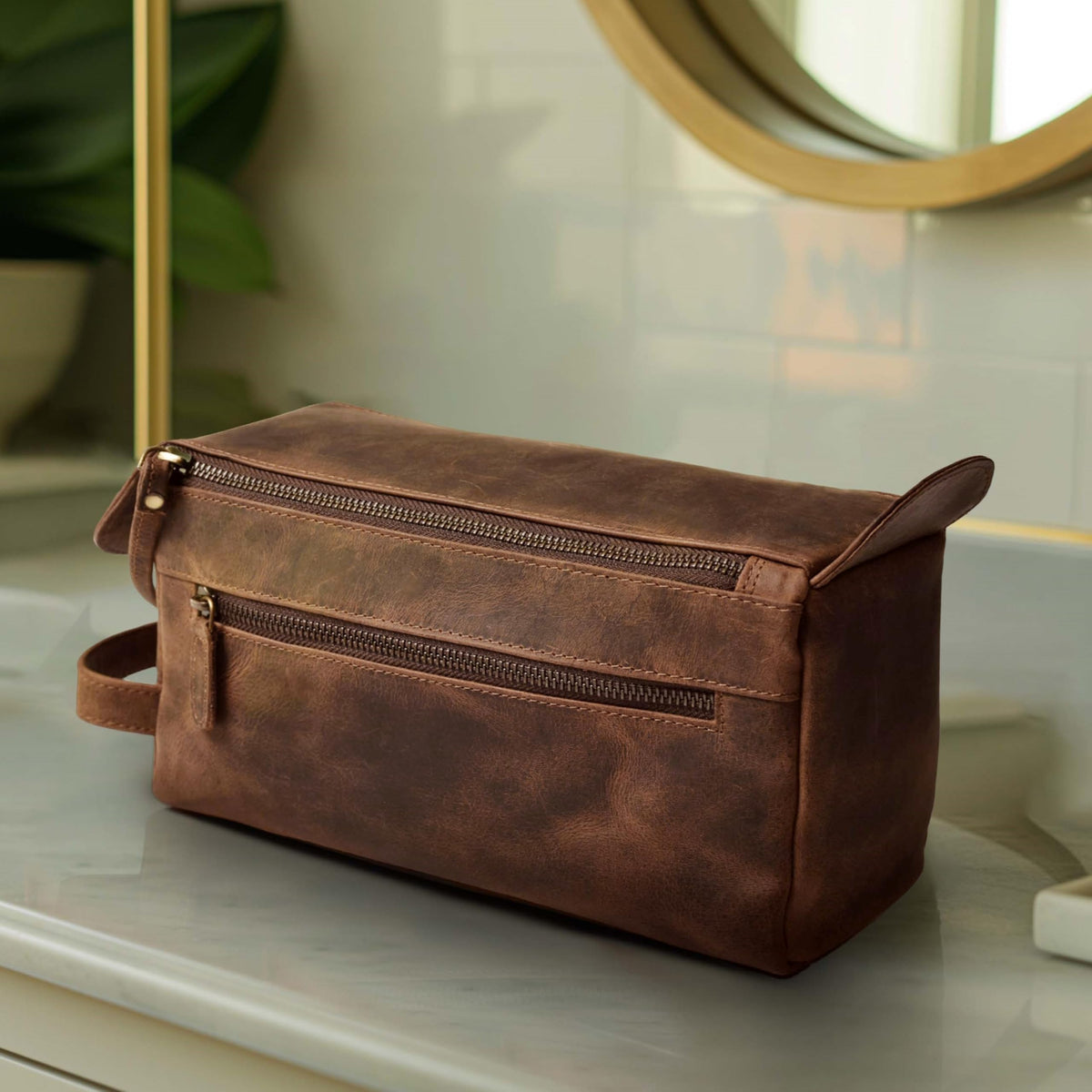Leather & Latch antique-brass fittings add a vintage, durable touch.