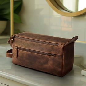 Leather & Latch antique-brass fittings add a vintage, durable touch.