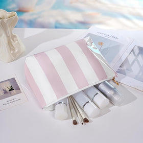 Lestikave cosmetic bag with a printed nylon interior and stylish design.
