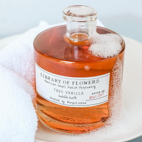 Vanilla amber fragrance evokes a calming bath ambiance with Library of Flowers
