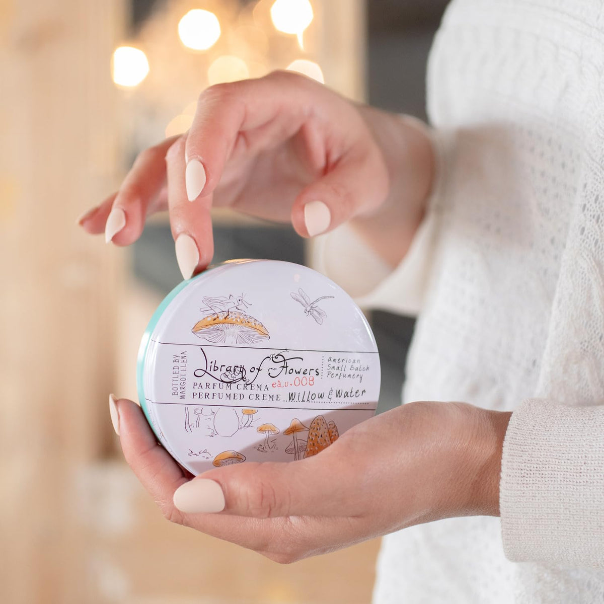 Library of Flowers packaging artisanal tin display emphasizes the scent story.
