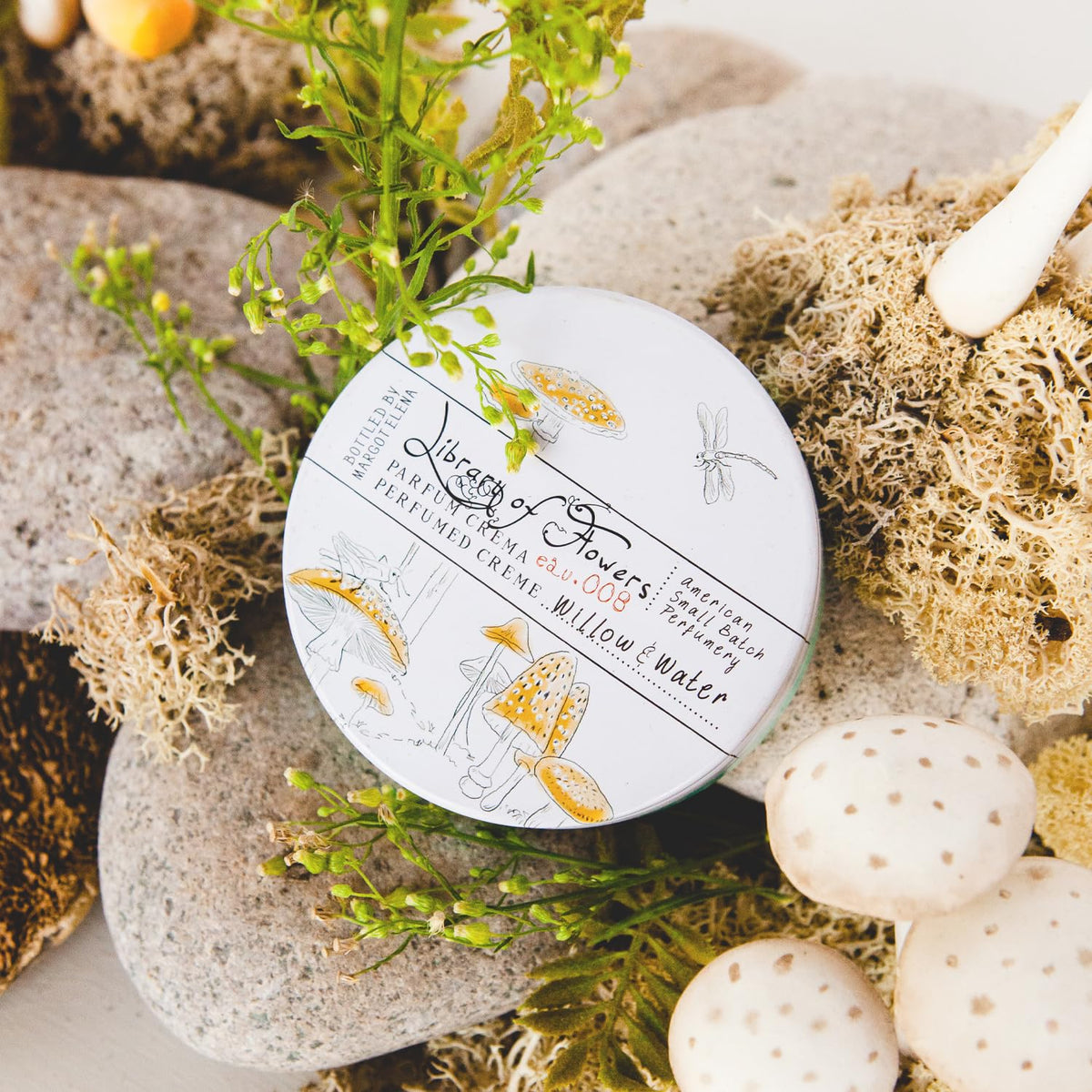 Library of Flowers solid perfume crème jar detail reveals luxe finish and triple-scent concept.