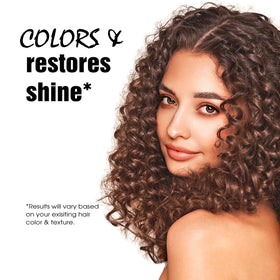 Light Mountain henna color applied to hair for even result.