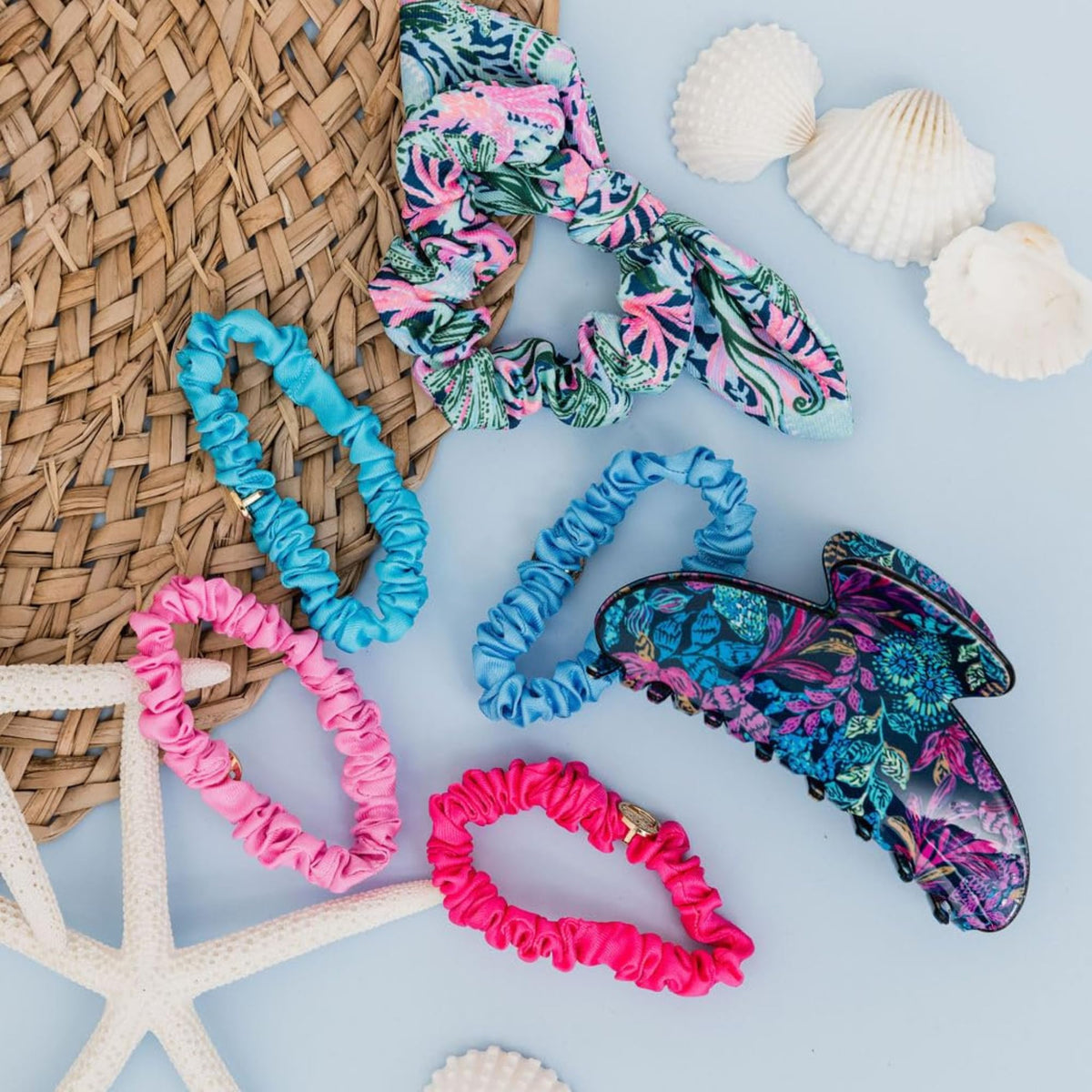 Soft colored patterned Lilly Pulitzer scrunchies highlight playful styling options