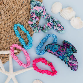 Soft colored patterned Lilly Pulitzer scrunchies highlight playful styling options