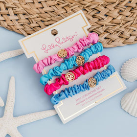 Satin scrunchie worn on wrist as a chic accessory by Lilly Pulitzer